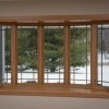 Bow window with prairie grids, vinyl windows, wood grain grids and golden oak interior in Franklin, WI