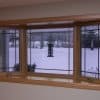 Bay window with prairie grids, golden oak interior stain and laminated seat in Franklin, WI