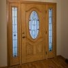 Entry Door with two sidelites & oval leaded glass & natural oak interior stain in Franklin, WI