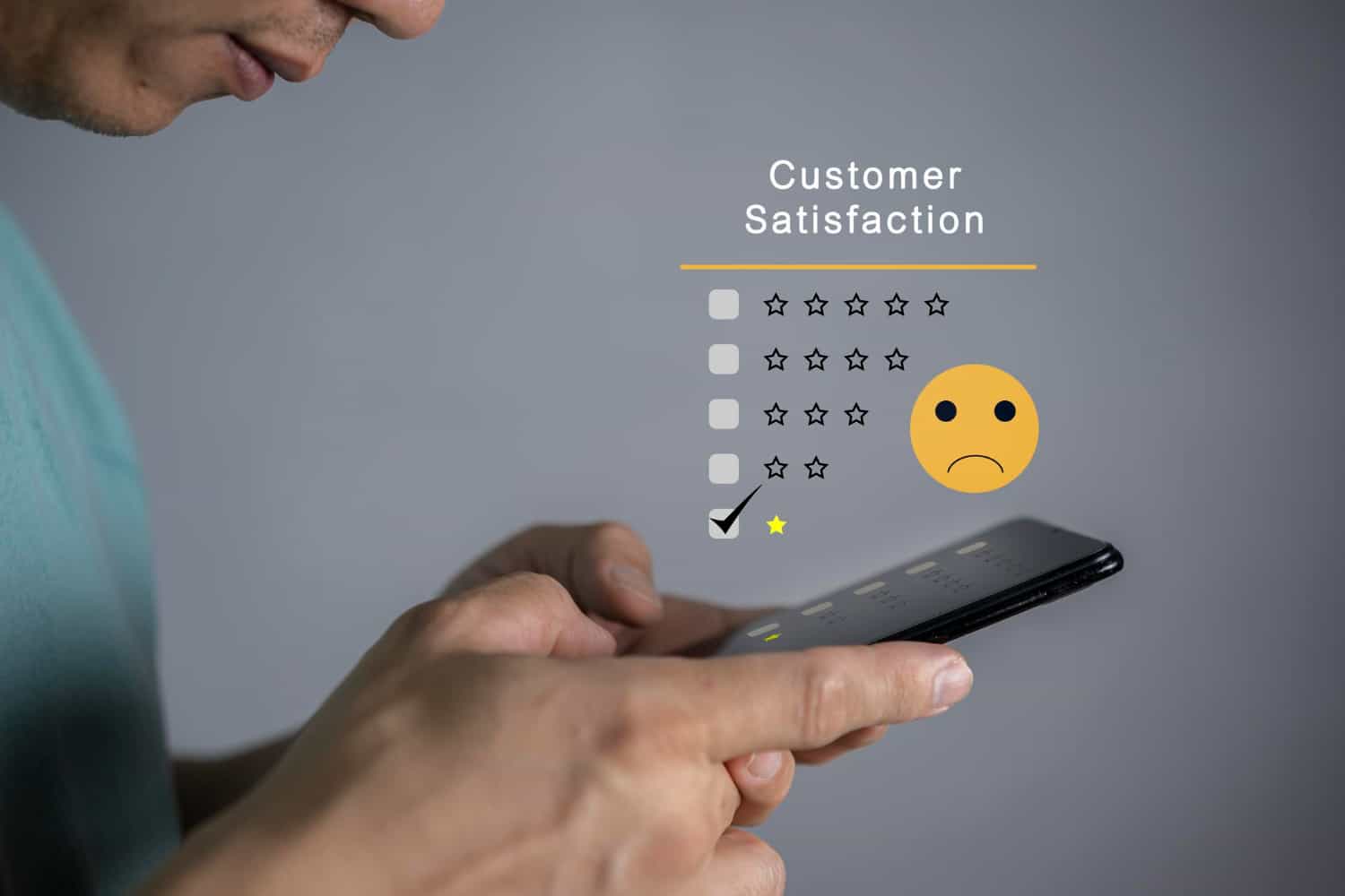 Image shows a close up profile view of a man looking down at his phone screen. The image has a graphic of a star rating scale, with the one-star box checked and a yellow frowning face.